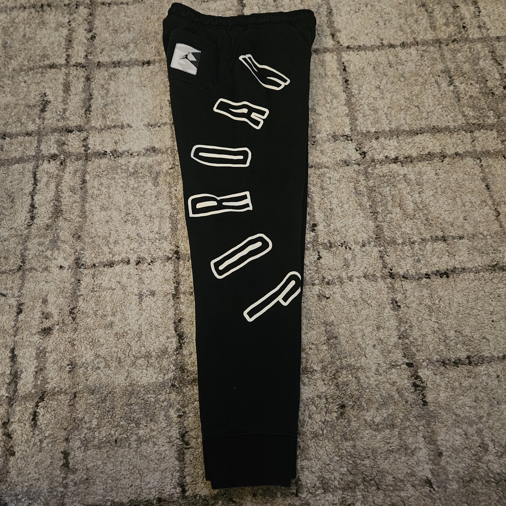 Jordan Black Apparel with Red Logo